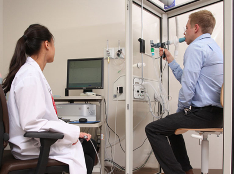 Clinical pulmonary function testing environment with medical staff
